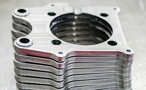 Fine blanked precision part produced from carefully selected material grade with 100% shear edge quality