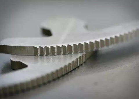 Precision fine-blanked component with mirror finish edge