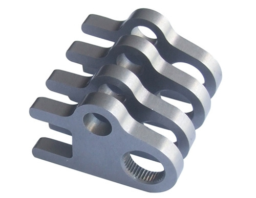 Fine blanked chain link components showing clean edges and precise hole geometry